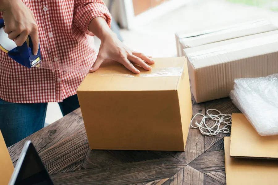 Bulldog Moving team carefully packing boxes